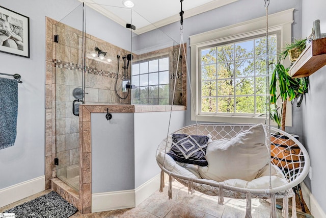 full bath with crown molding, baseboards, and a shower stall