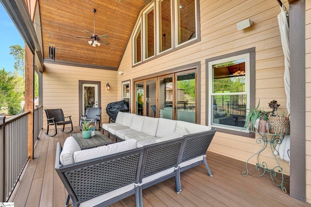 deck featuring an outdoor living space and ceiling fan