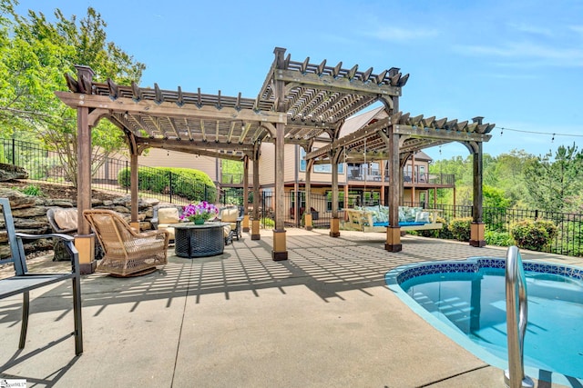 view of swimming pool with a pergola, fence, a patio area, and a pool