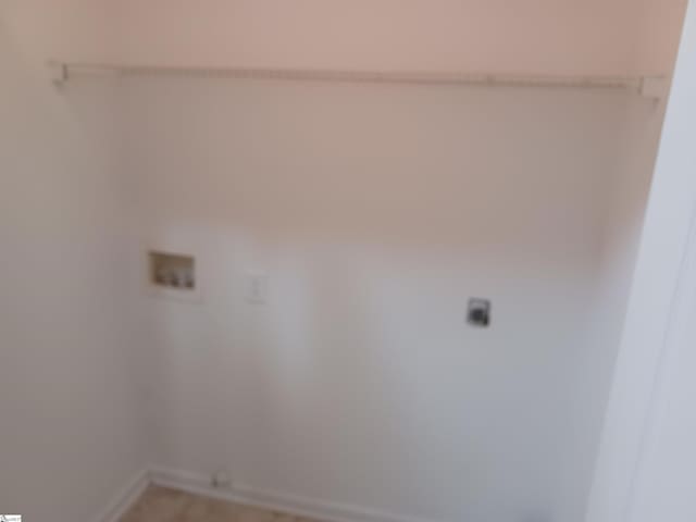 laundry area featuring baseboards, washer hookup, and electric dryer hookup