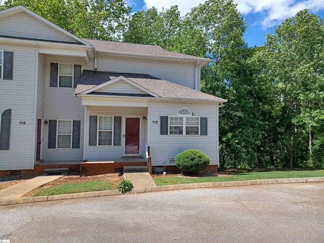 view of front of property with roof with shingles