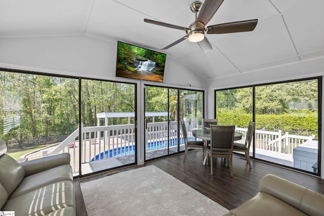 sunroom featuring ceiling fan and outdoor dining space