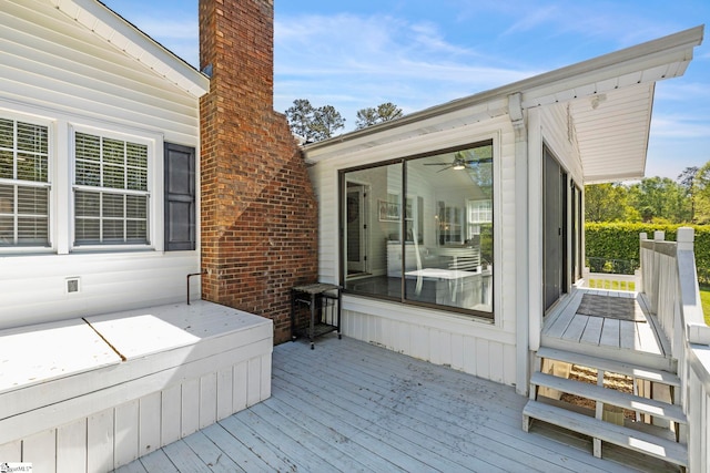 wooden deck with a sunroom