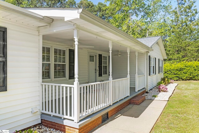 view of side of property featuring covered porch, a ceiling fan, and roof with shingles