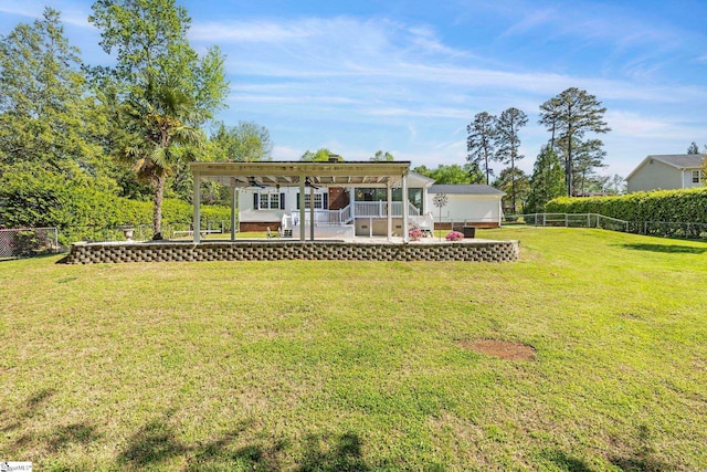 back of property featuring a lawn, a fenced backyard, and a patio area