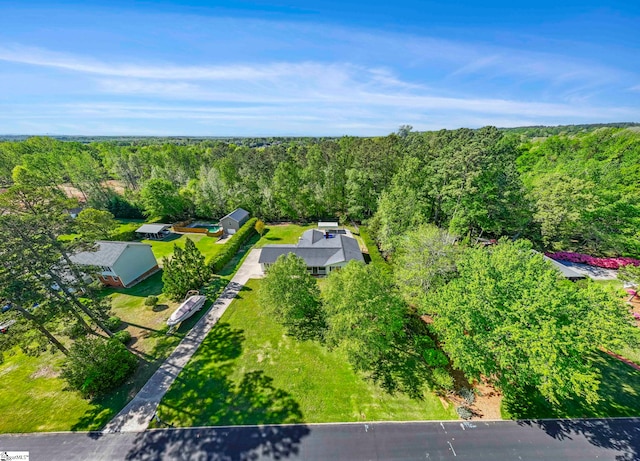 aerial view featuring a wooded view