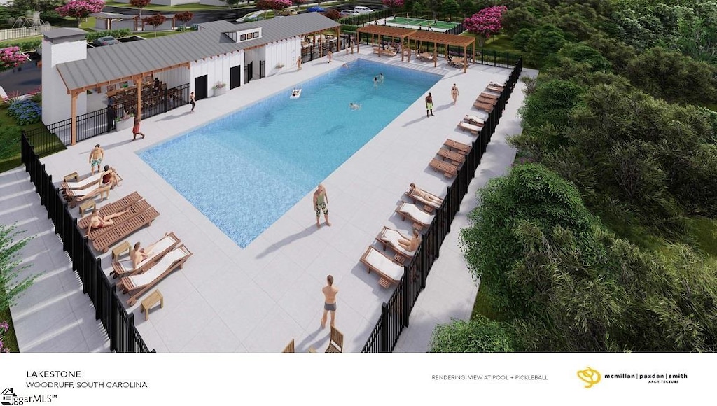 pool featuring a patio area and fence