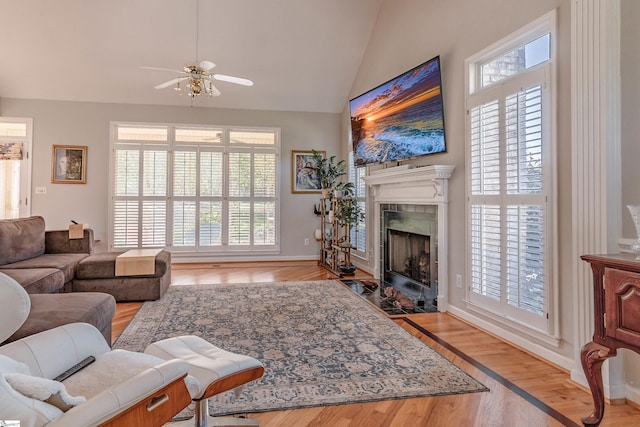 104 Bellewood Dr, Easley, SC 29640 - living area with light wood finished floors, a fireplace, high vaulted ceiling, a ceiling fan, and baseboards