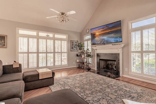 104 Bellewood Dr, Easley, SC 29640 - living area featuring ceiling fan, high vaulted ceiling, baseboards, wood finished floors, and a tile fireplace