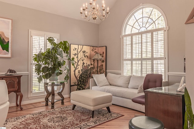 104 Bellewood Dr, Easley, SC 29640 - living room featuring a healthy amount of sunlight, an inviting chandelier, and wood finished floors