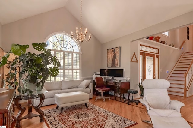 104 Bellewood Dr, Easley, SC 29640 - living room featuring stairs, high vaulted ceiling, a notable chandelier, and light wood-type flooring