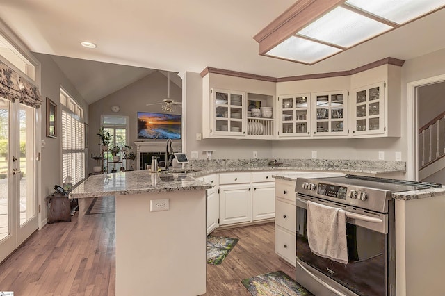 104 Bellewood Dr, Easley, SC 29640 - kitchen with stainless steel electric range oven, white cabinets, a sink, a peninsula, and glass insert cabinets