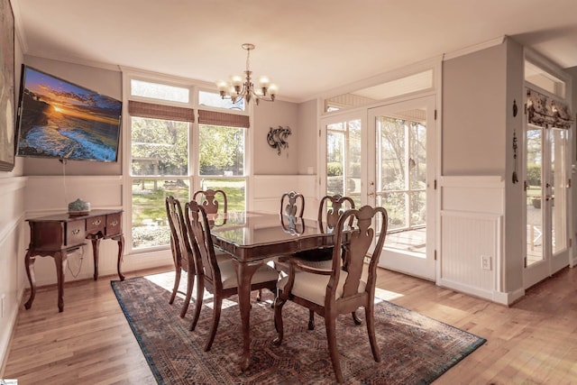 104 Bellewood Dr, Easley, SC 29640 - dining room with a notable chandelier, wainscoting, ornamental molding, and a decorative wall
