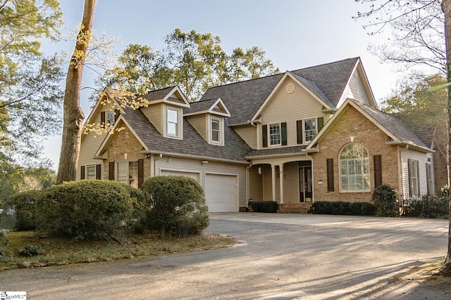 104 Bellewood Dr, Easley, SC 29640 - view of front facade with brick siding, a garage, roof with shingles, and aphalt driveway