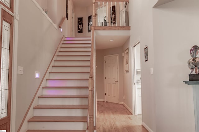 104 Bellewood Dr, Easley, SC 29640 - stairway with baseboards, a high ceiling, and wood finished floors
