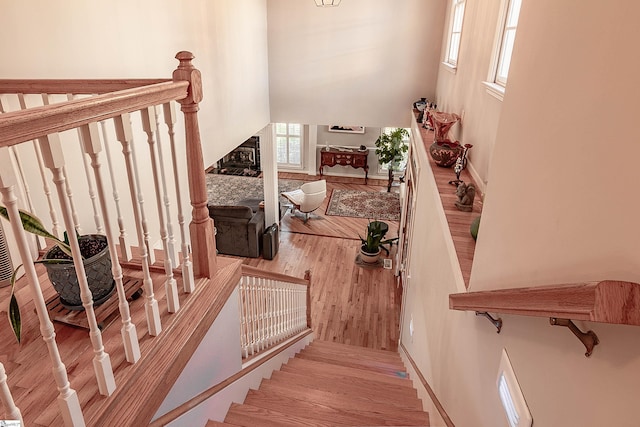 104 Bellewood Dr, Easley, SC 29640 - stairway featuring baseboards, wood finished floors, and a towering ceiling
