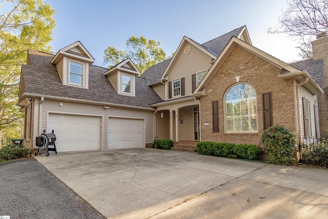 104 Bellewood Dr, Easley, SC 29640 - view of front of home with roof with shingles, an attached garage, concrete driveway, and brick siding
