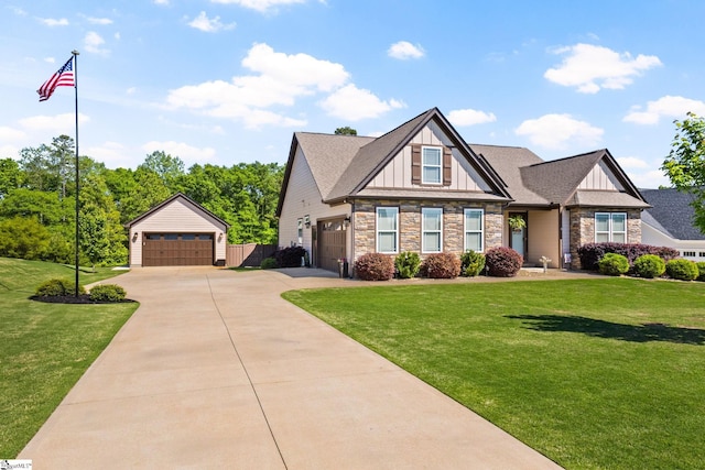 craftsman house featuring board and batten siding, a front yard, and stone siding