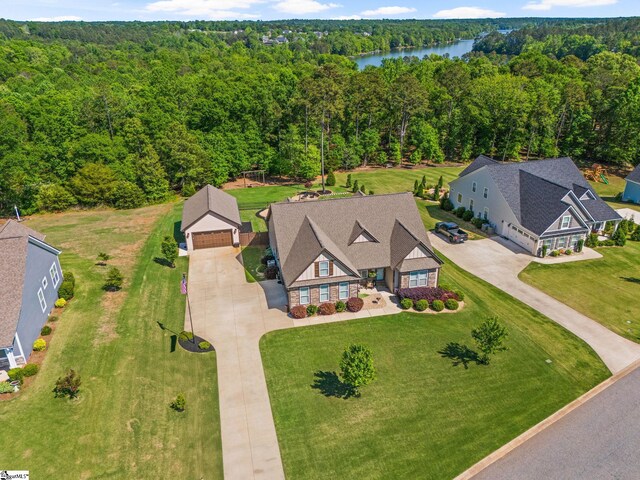 aerial view featuring a water view and a view of trees