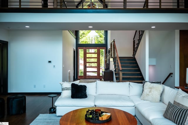 living area featuring stairway, recessed lighting, and wood finished floors
