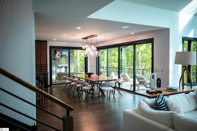 dining room with recessed lighting, wood finished floors, and a chandelier