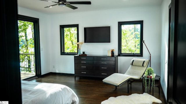 bedroom featuring baseboards, dark wood-style floors, and access to exterior