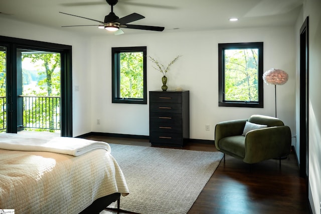 bedroom featuring recessed lighting, dark wood finished floors, multiple windows, and access to exterior