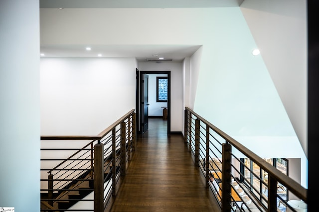 corridor featuring recessed lighting, an upstairs landing, wood finished floors, and visible vents