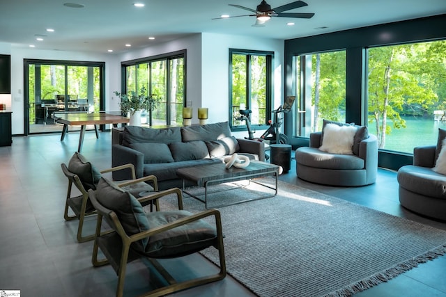 living area with recessed lighting, ceiling fan, and a healthy amount of sunlight