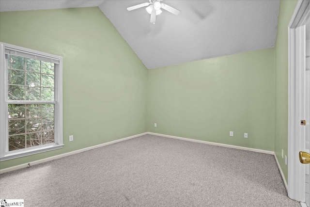 bonus room with a ceiling fan, a textured ceiling, baseboards, lofted ceiling, and carpet