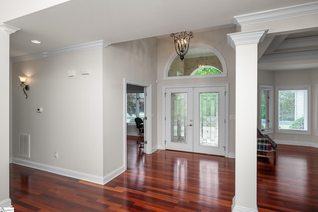 entryway featuring baseboards, crown molding, wood finished floors, and french doors