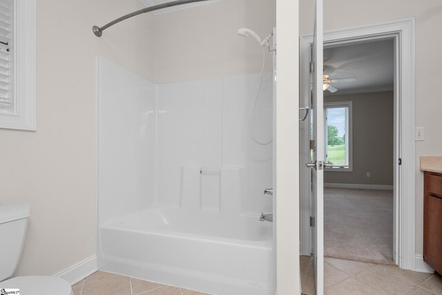 full bathroom featuring ceiling fan, crown molding, tile patterned flooring, baseboards, and vanity