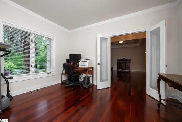 office featuring crown molding, baseboards, wood finished floors, and visible vents
