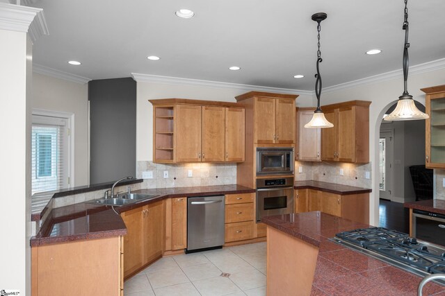 kitchen featuring open shelves, a peninsula, tile counters, a sink, and appliances with stainless steel finishes