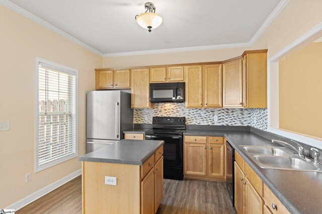 kitchen with dark wood-style flooring, crown molding, dark countertops, a sink, and black appliances