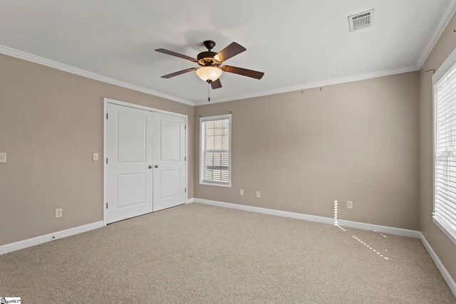 unfurnished bedroom featuring carpet flooring, baseboards, and visible vents