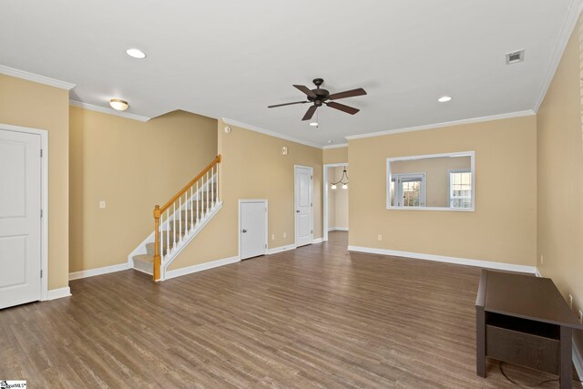 unfurnished living room with baseboards, visible vents, and wood finished floors