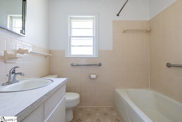 2403 Dobbins Bridge Rd, Anderson, SC 29626 - full bath featuring toilet, tile walls, plenty of natural light, and tile patterned flooring