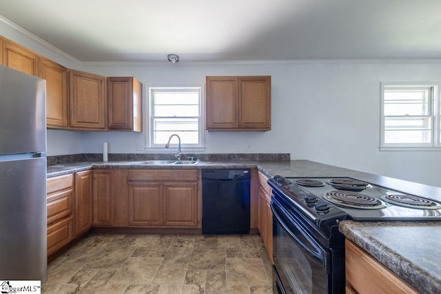 2403 Dobbins Bridge Rd, Anderson, SC 29626 - kitchen featuring brown cabinetry, stone finish flooring, dark countertops, a sink, and black appliances