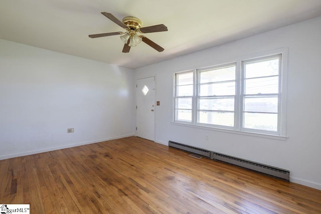 2403 Dobbins Bridge Rd, Anderson, SC 29626 - interior space featuring wood finished floors, a ceiling fan, baseboards, and a baseboard heating unit