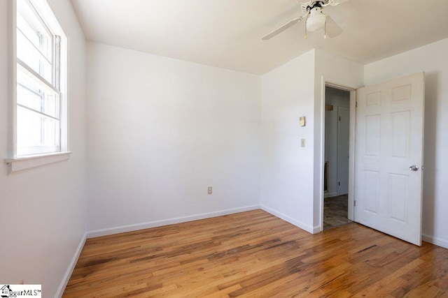 2403 Dobbins Bridge Rd, Anderson, SC 29626 - unfurnished bedroom featuring light wood-type flooring, a ceiling fan, and baseboards