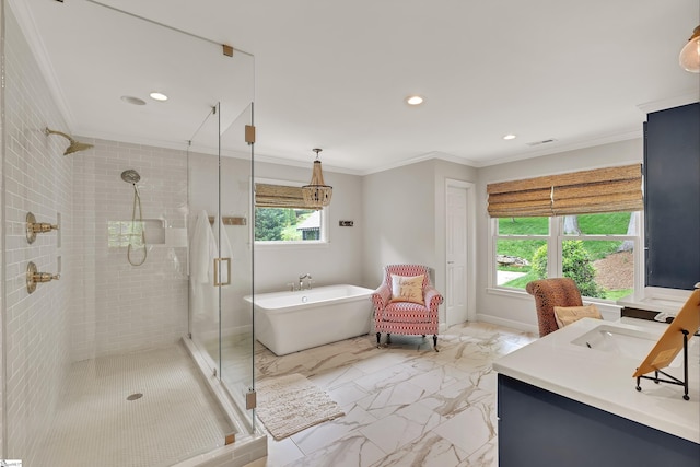 full bathroom with a freestanding tub, ornamental molding, marble finish floor, and a stall shower