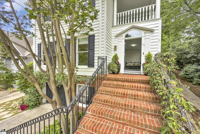 doorway to property featuring a balcony