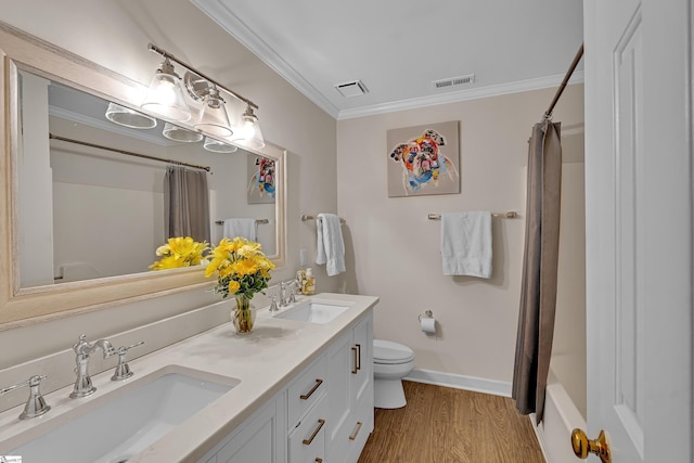 bathroom featuring visible vents, a sink, and toilet