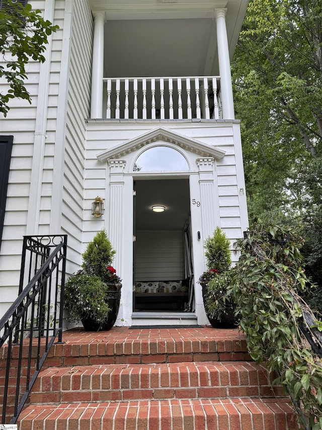 entrance to property with a balcony