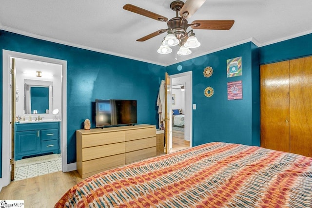 207 Tollgate Rd, Simpsonville, SC 29681 - bedroom with a closet, ornamental molding, light wood-style floors, ceiling fan, and a sink