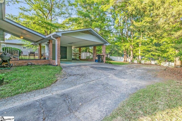 207 Tollgate Rd, Simpsonville, SC 29681 - view of parking / parking lot with a carport and driveway
