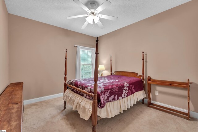 201 Cedar Creek Ln, Seneca, SC 29678 - carpeted bedroom with baseboards, a ceiling fan, and a textured ceiling