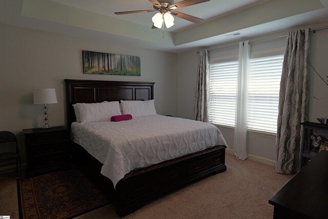 502 E Heatherstone Ln, Roebuck, SC 29376 - bedroom with a ceiling fan, baseboards, light colored carpet, and a raised ceiling