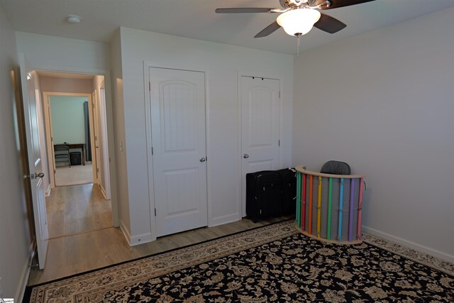 502 E Heatherstone Ln, Roebuck, SC 29376 - unfurnished bedroom featuring baseboards, ceiling fan, and light wood-type flooring